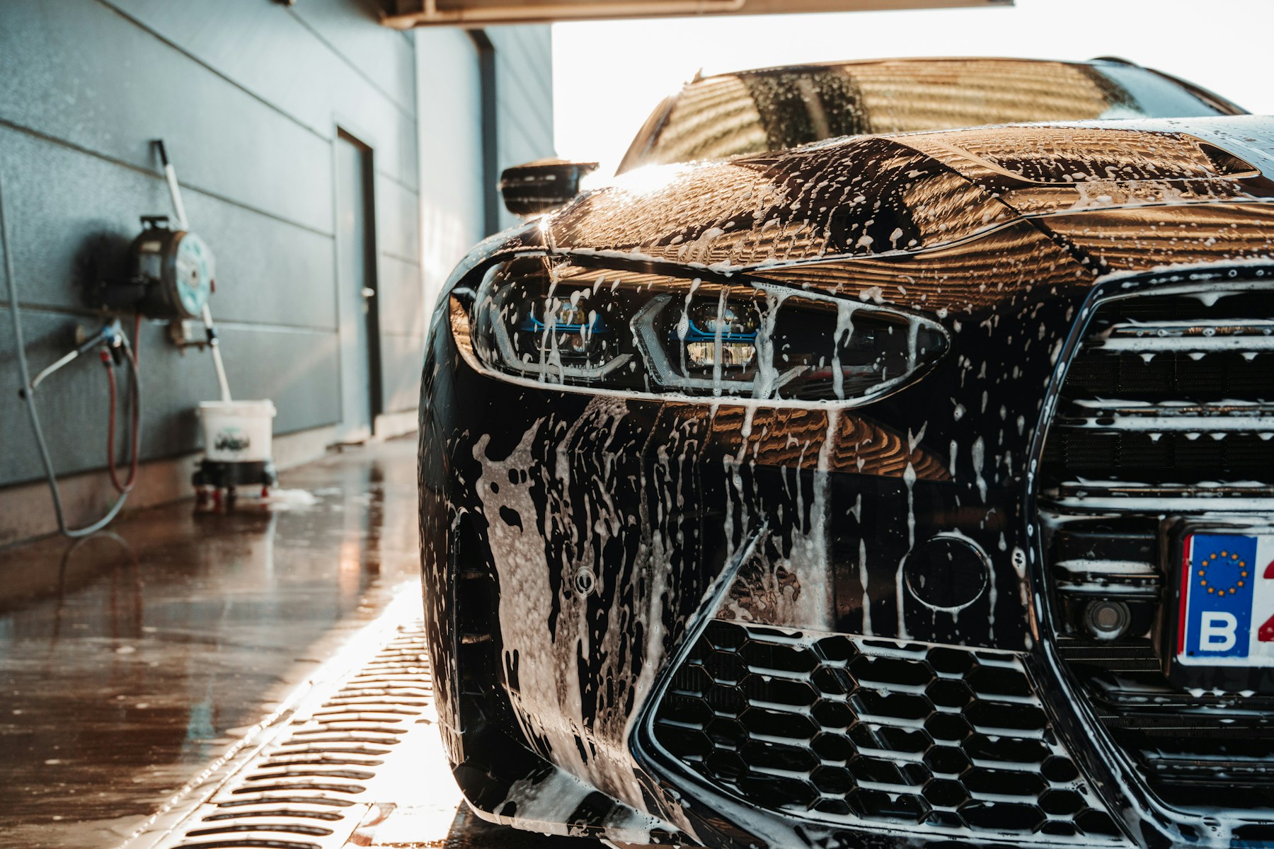 Licensed stock photo showing a hands-on car detailing process